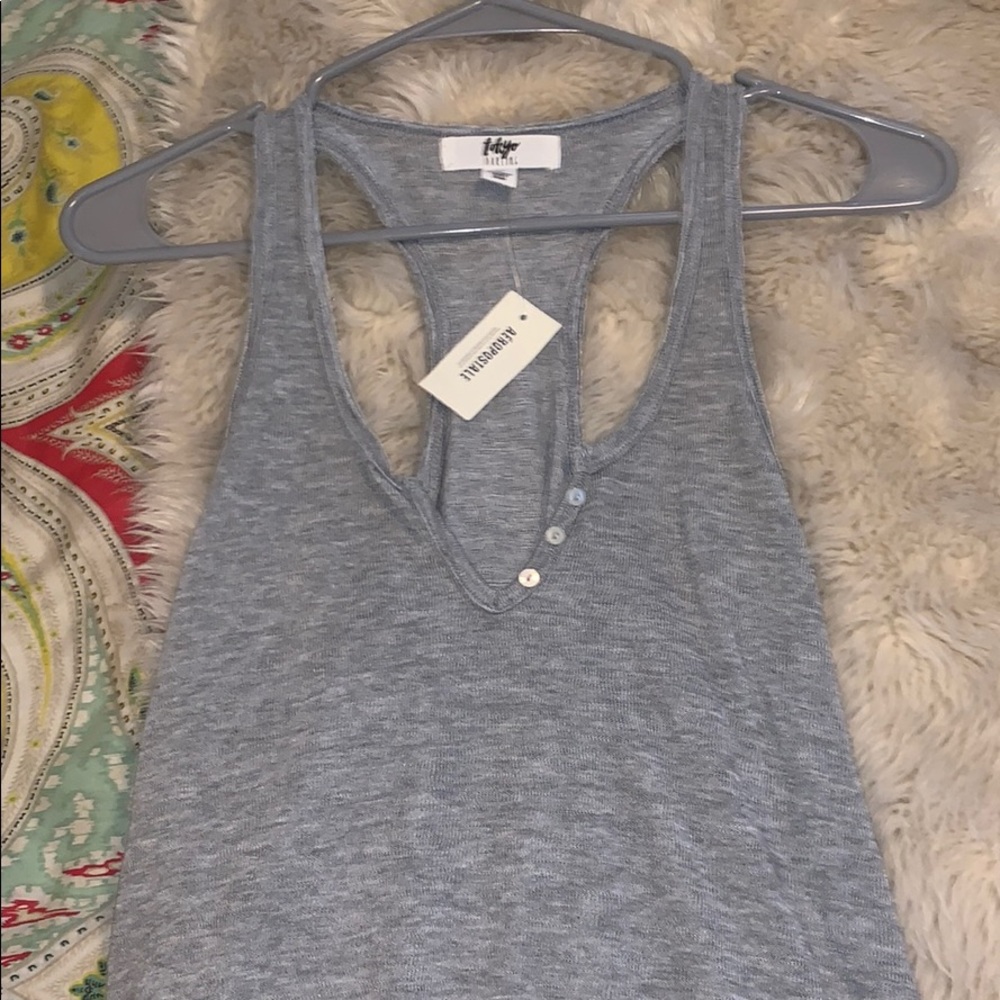 Tank with buttons
